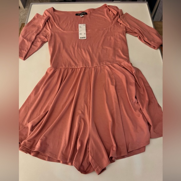 Urban Outfitters Pants - NWT Urban Outfitters pink long sleeve romper